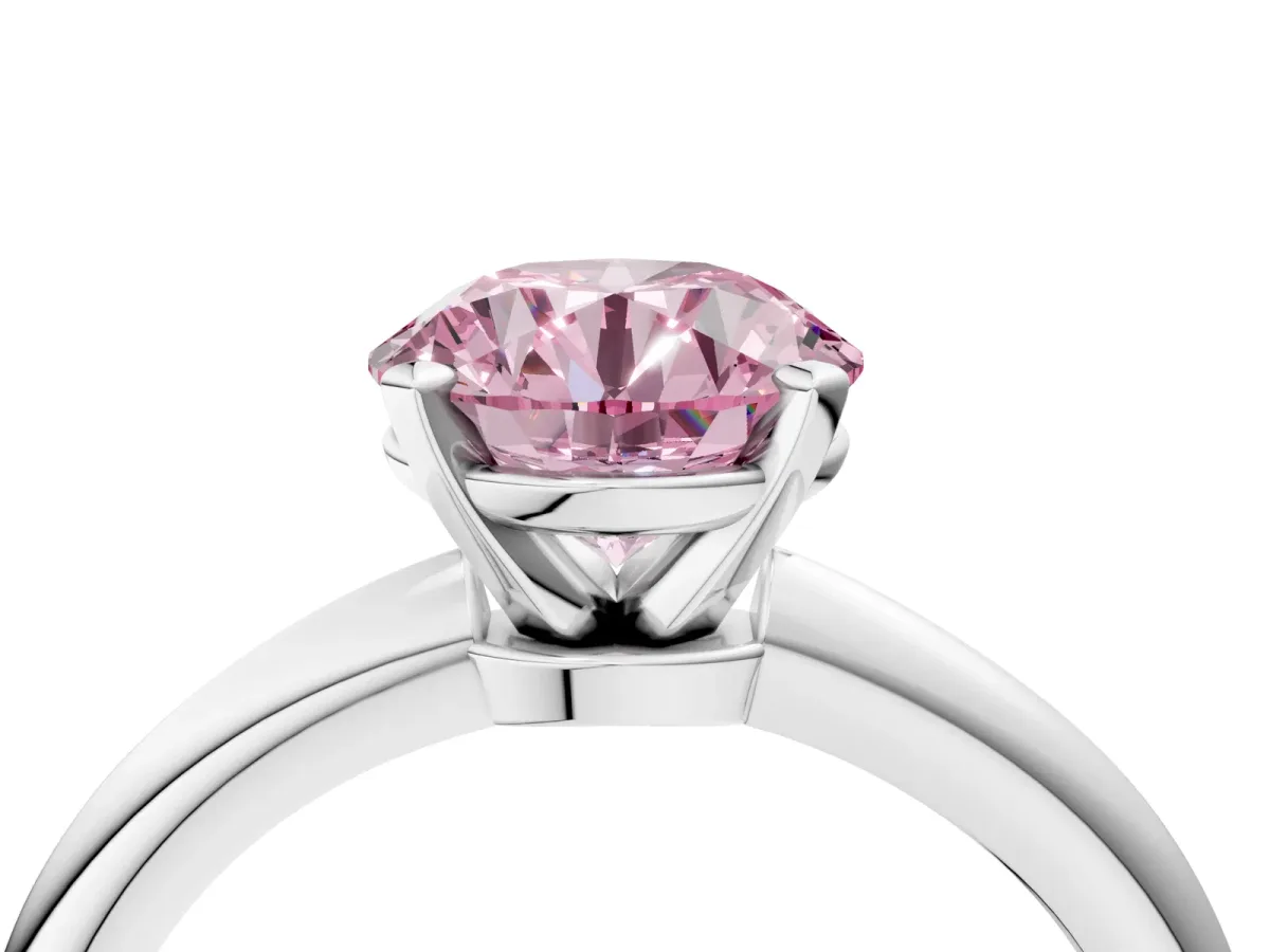 Fancy Pink Round Cut Diamond Solitaire Ring with Six-Prong Setting and Classic Band Silver