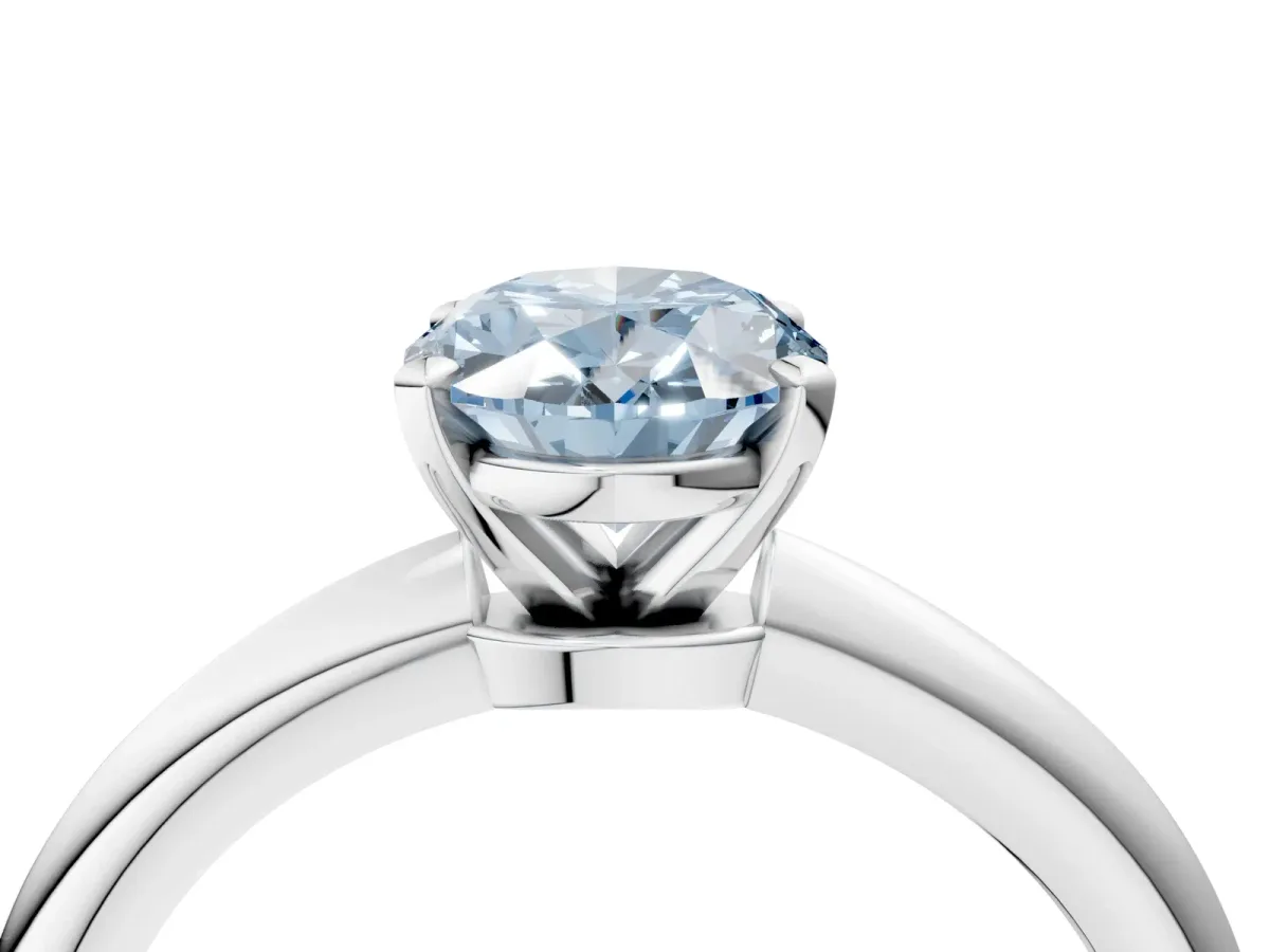 Fancy Blue Oval Cut Diamond Solitaire Ring with Six-Prong Setting and Classic Band Silver