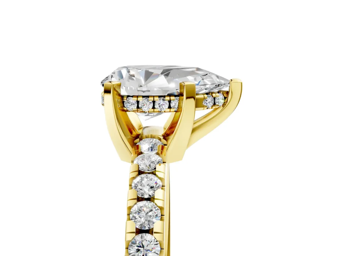 Pear Cut Diamond Solitaire Ring with Round Pavé Band and Four-Prong Setting Yellow gold