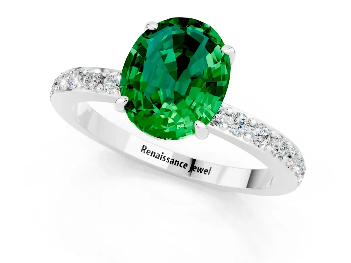 Oval Cut Emerald Solitaire Engagement Ring with Pavé Band and Four-Prong Setting Silver
