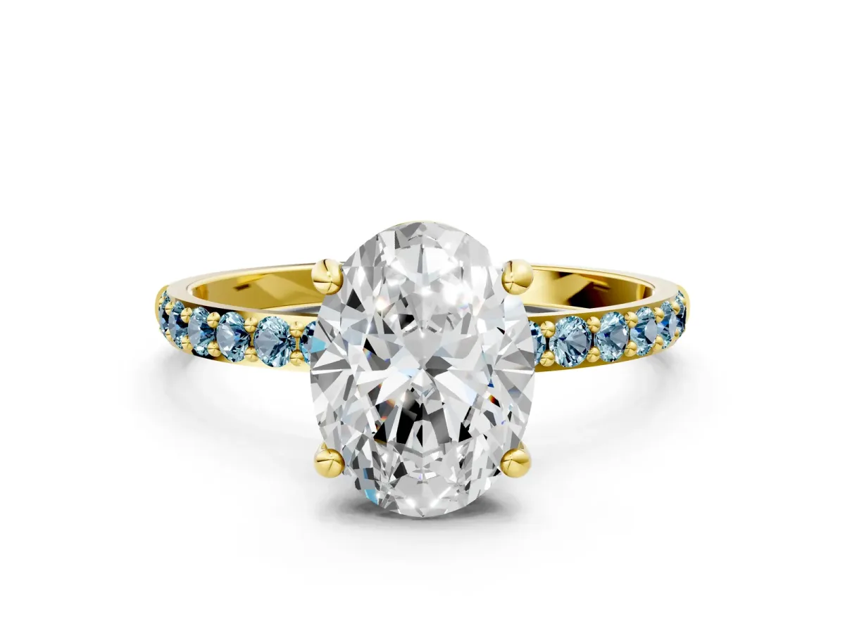 Oval Cut Diamond Solitaire Ring with Round Aquamarine Pavé Band and Prong Setting Yellow gold