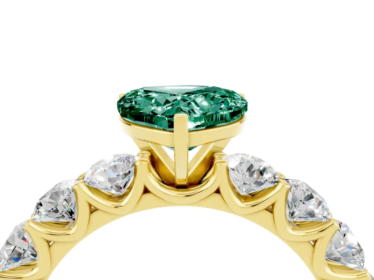 Heart Cut Green Sapphire Prong Setting with Side Stones on a Pave Band Yellow gold