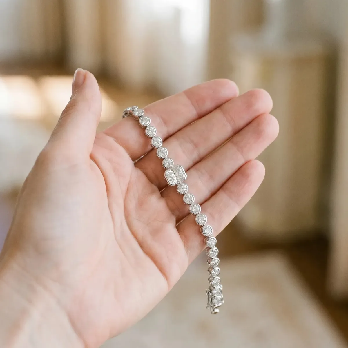 Bezel-Set Round Diamond Tennis Bracelet with Radiant Center Diamond White gold