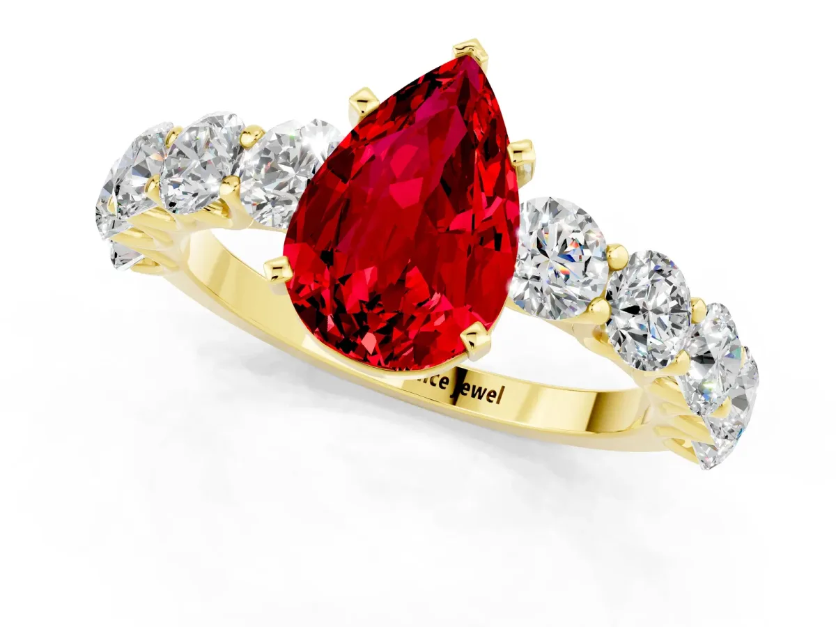 Pear Cut Ruby Prong Setting with Side Stones on a Pave Band Yellow gold