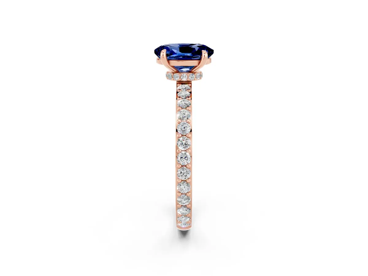 Oval Cut Blue Sapphire Solitaire Engagement Ring with Pavé Band and Four-Prong Setting Rose gold