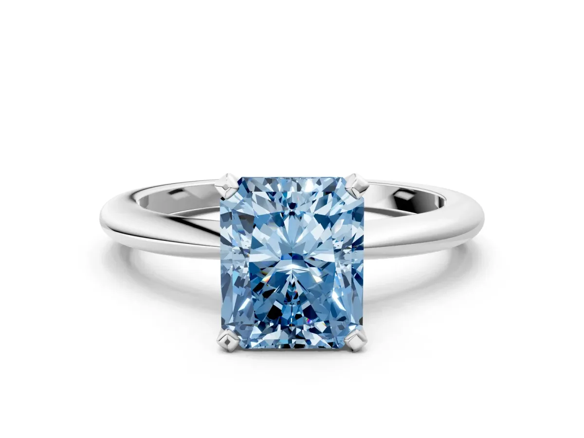 Fancy Blue Radiant Cut Diamond Solitaire Ring with Six-Prong Setting and Classic Band Silver