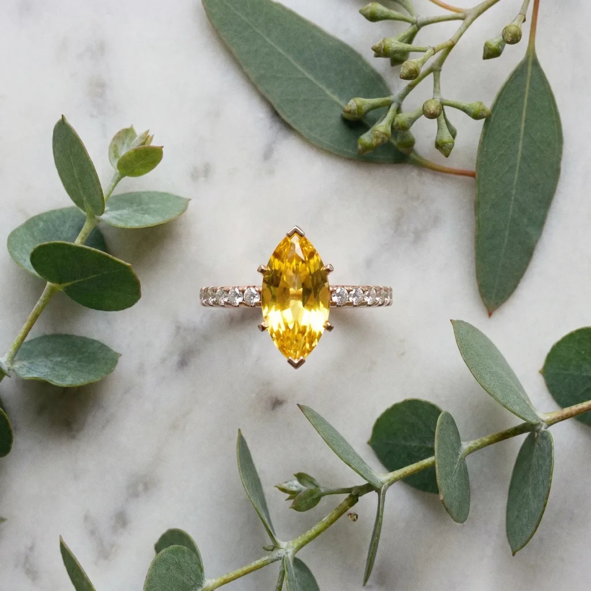 Marquise Cut Yellow Sapphire Solitaire Ring with Round Pavé Band and Four-Prong Setting Rose gold