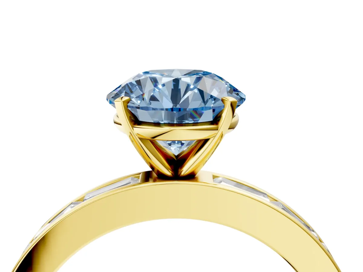 Fancy Blue Round Cut Solitaire Diamond Ring with Channel-Set Baguette Band and Four-Prong Setting Yellow gold