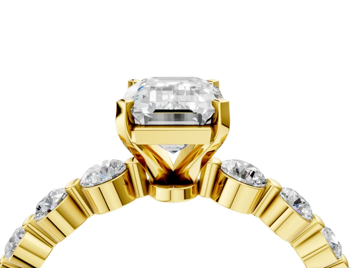 Emerald Cut Solitaire Diamond Ring with Pave Band and Four-Prong Setting Yellow gold