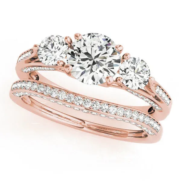 Round Cut Brilliant Three-Stone Engagement Ring with Split Shank and Prong Setting Rose gold