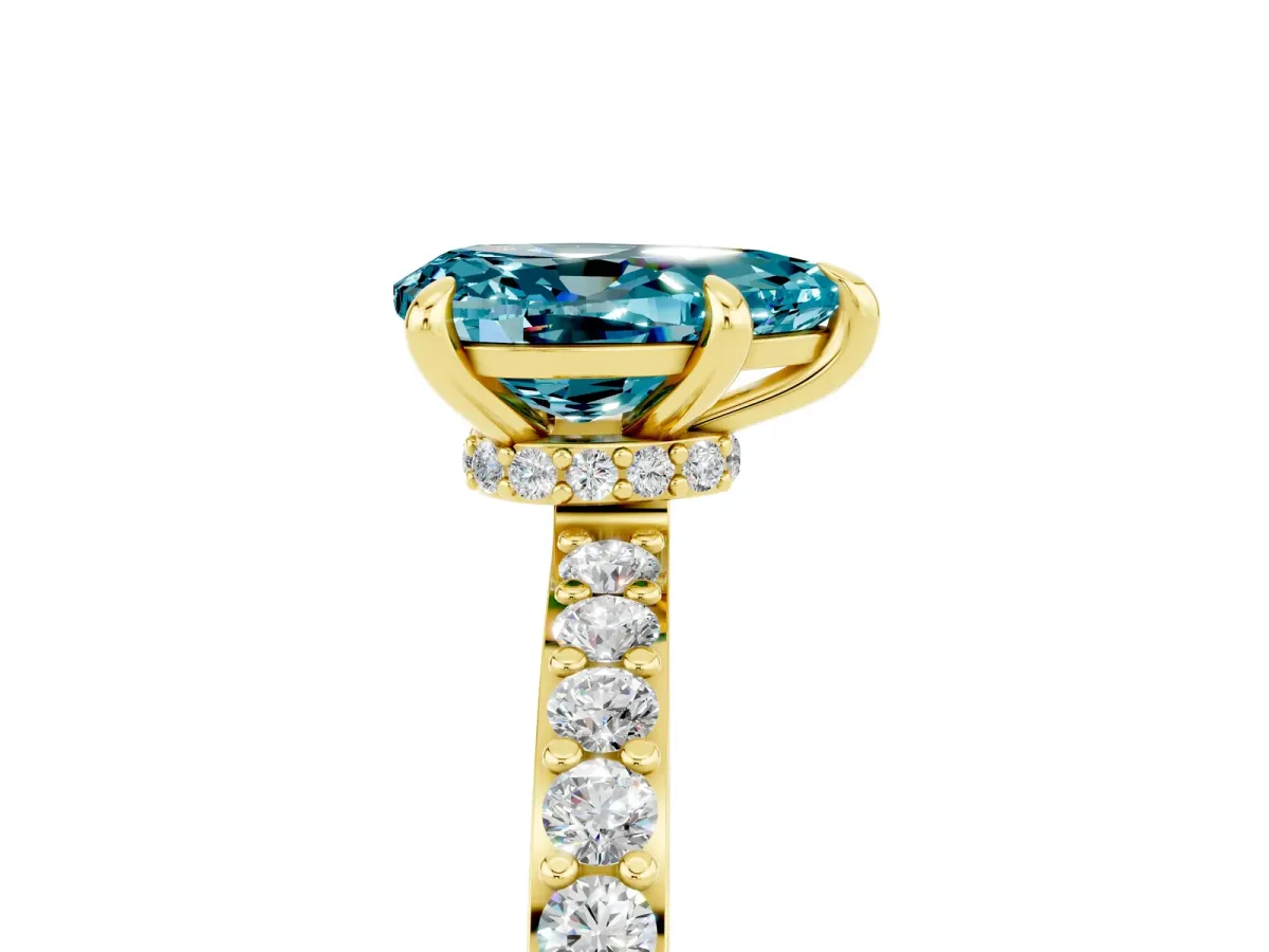 Pear Cut Blue Topaz Solitaire Engagement Ring with Pavé Band and Four-Prong Setting Yellow gold