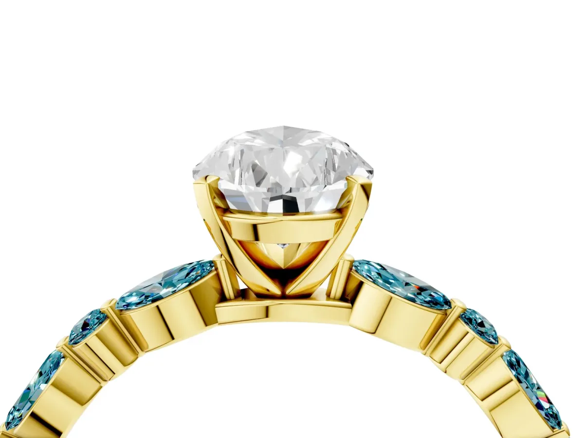 Pear Cut Diamond Ring with Marquise and Round Blue Topaz Side Stones and Four-Prong Setting Yellow gold