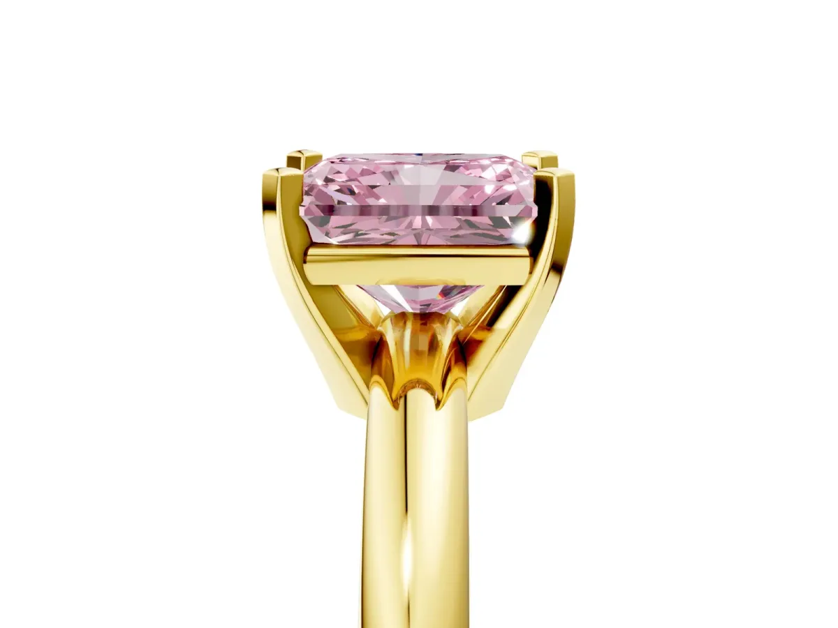 Fancy Pink Radiant Cut Diamond Solitaire Engagement Ring with Round Band and Four-Prong Setting Yellow gold