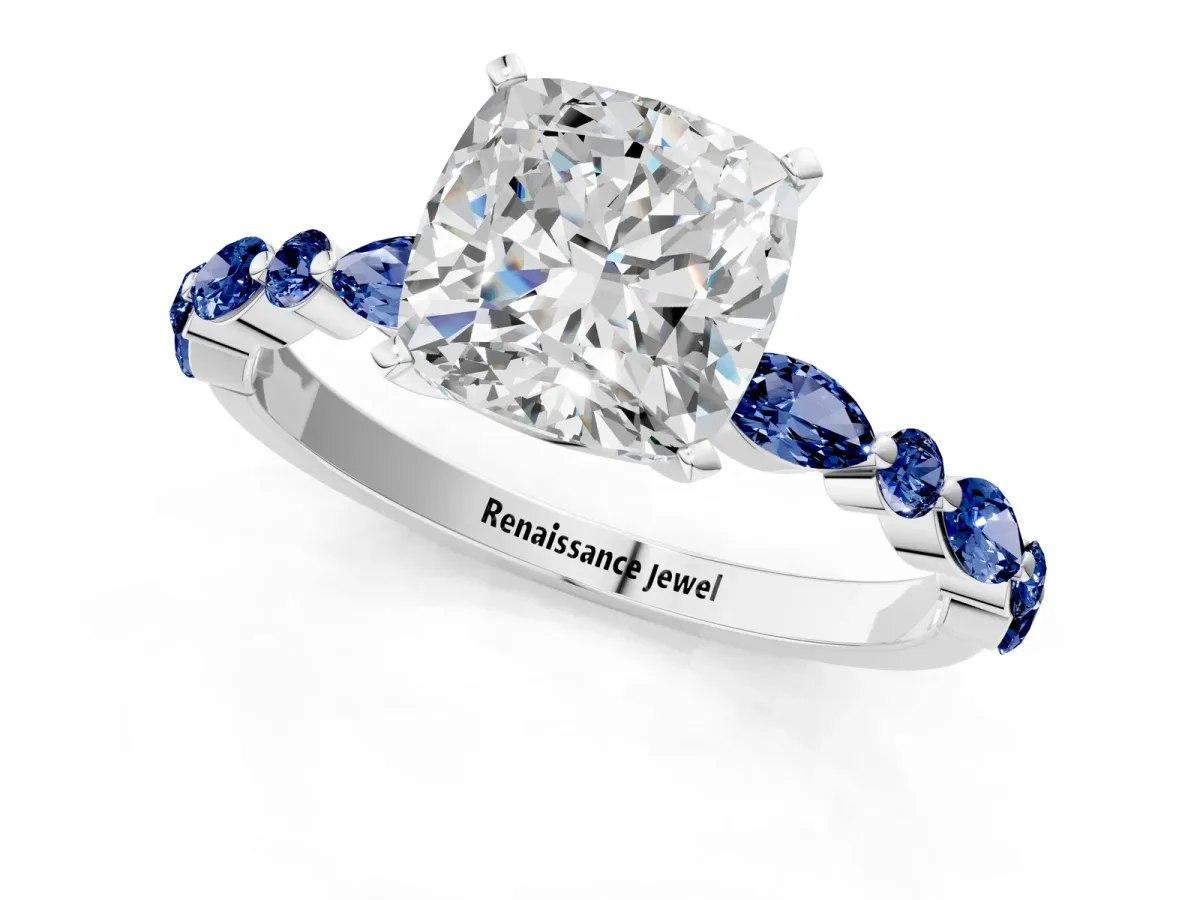 Cushion Cut Diamond Ring with Marquise and Round Blue Sapphire Side Stones and Four-Prong Setting White gold