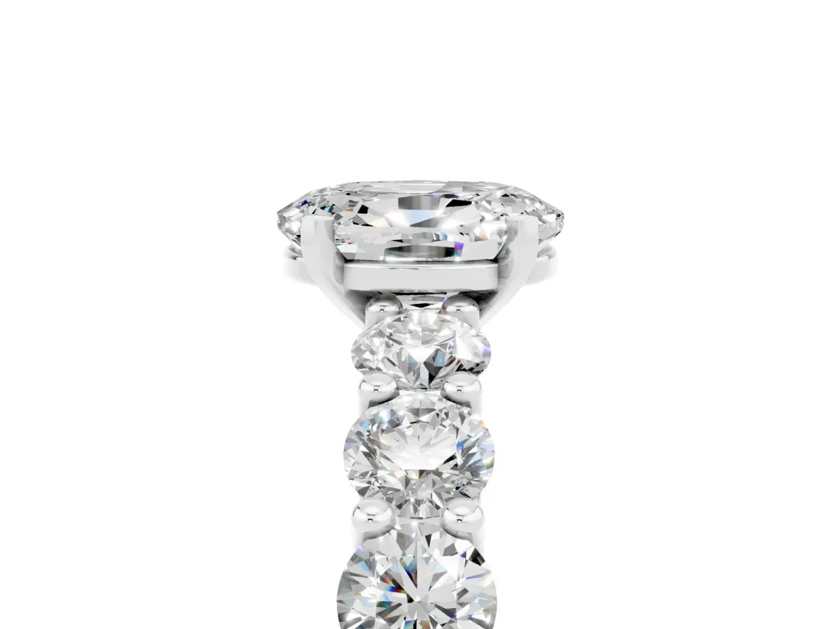 Oval Cut Moissanite Prong Setting with Side Stones on a Pave Band Silver