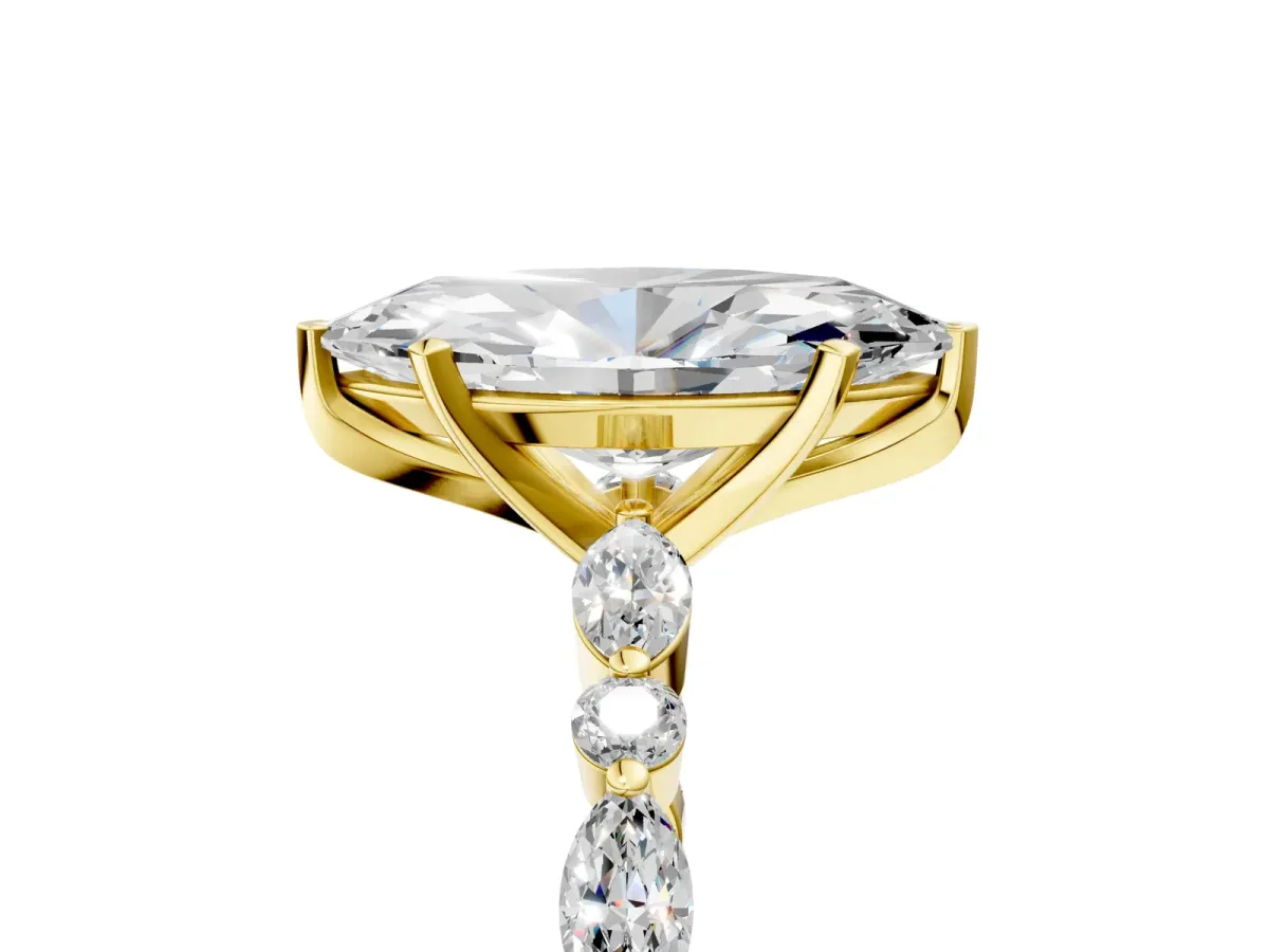 Marquise Cut Diamond Ring with Marquise and Round Side Stones and Four-Prong Setting Yellow gold