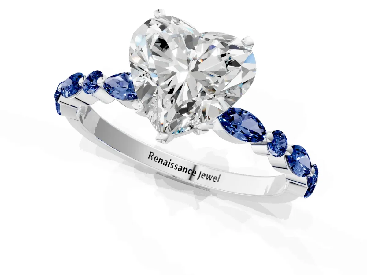 Heart Cut Diamond Ring with Marquise and Round Blue Sapphire Side Stones and Four-Prong Setting White gold