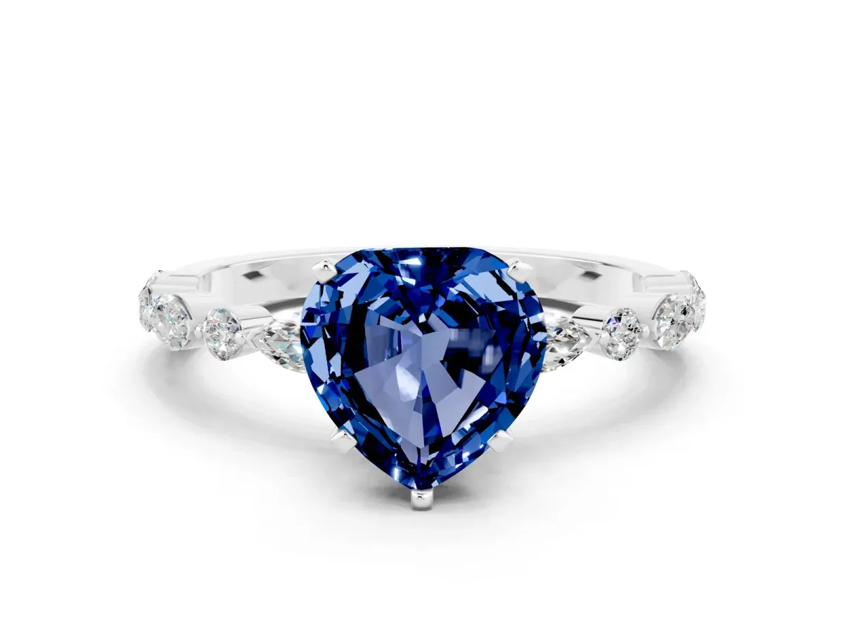 Heart Cut Blue Sapphire Ring with Marquise and Round Side Stones and Four-Prong Setting White gold