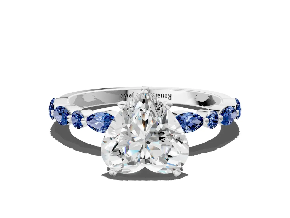 Heart Cut Diamond Ring with Marquise and Round Blue Sapphire Side Stones and Four-Prong Setting White gold