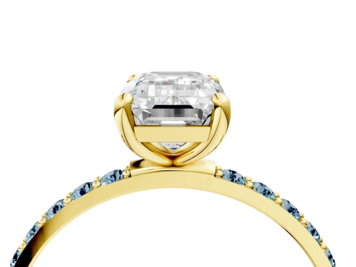 Emerald Cut Diamond Solitaire Ring with Round Aquamarine Pavé Band and Prong Setting Yellow gold
