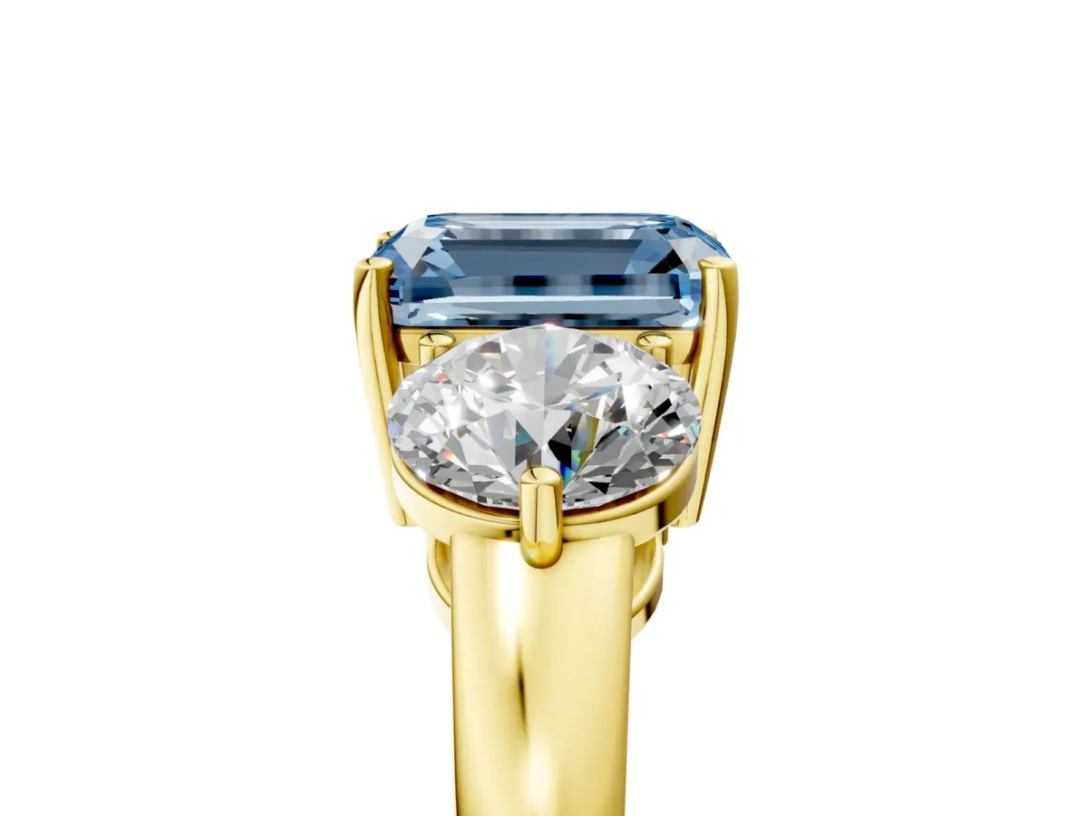 Fancy Blue Emerald Cut Diamond Three-Stone Ring with Prong Setting and Classic Band Yellow gold