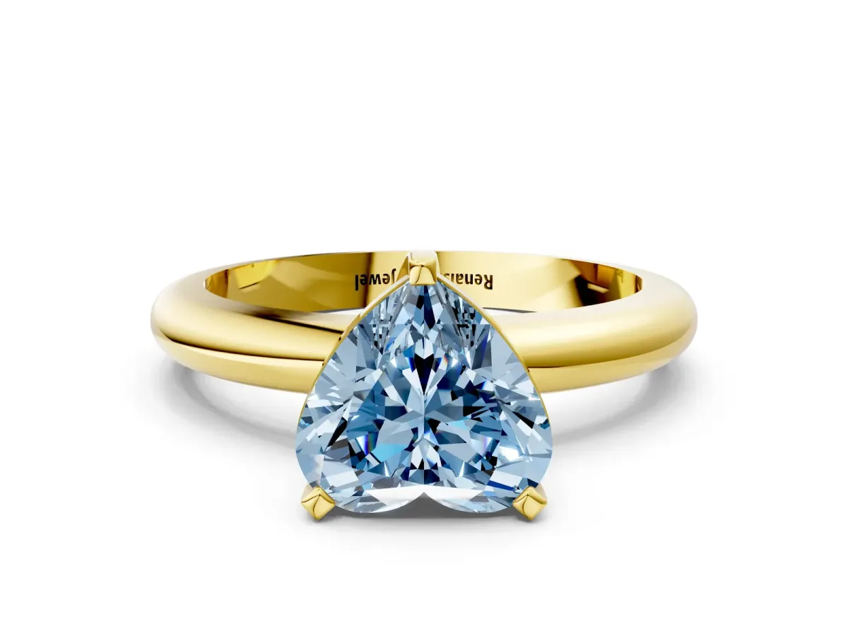 Fancy Blue Heart Cut Diamond Solitaire Engagement Ring with Round Band and Four-Prong Setting Yellow gold