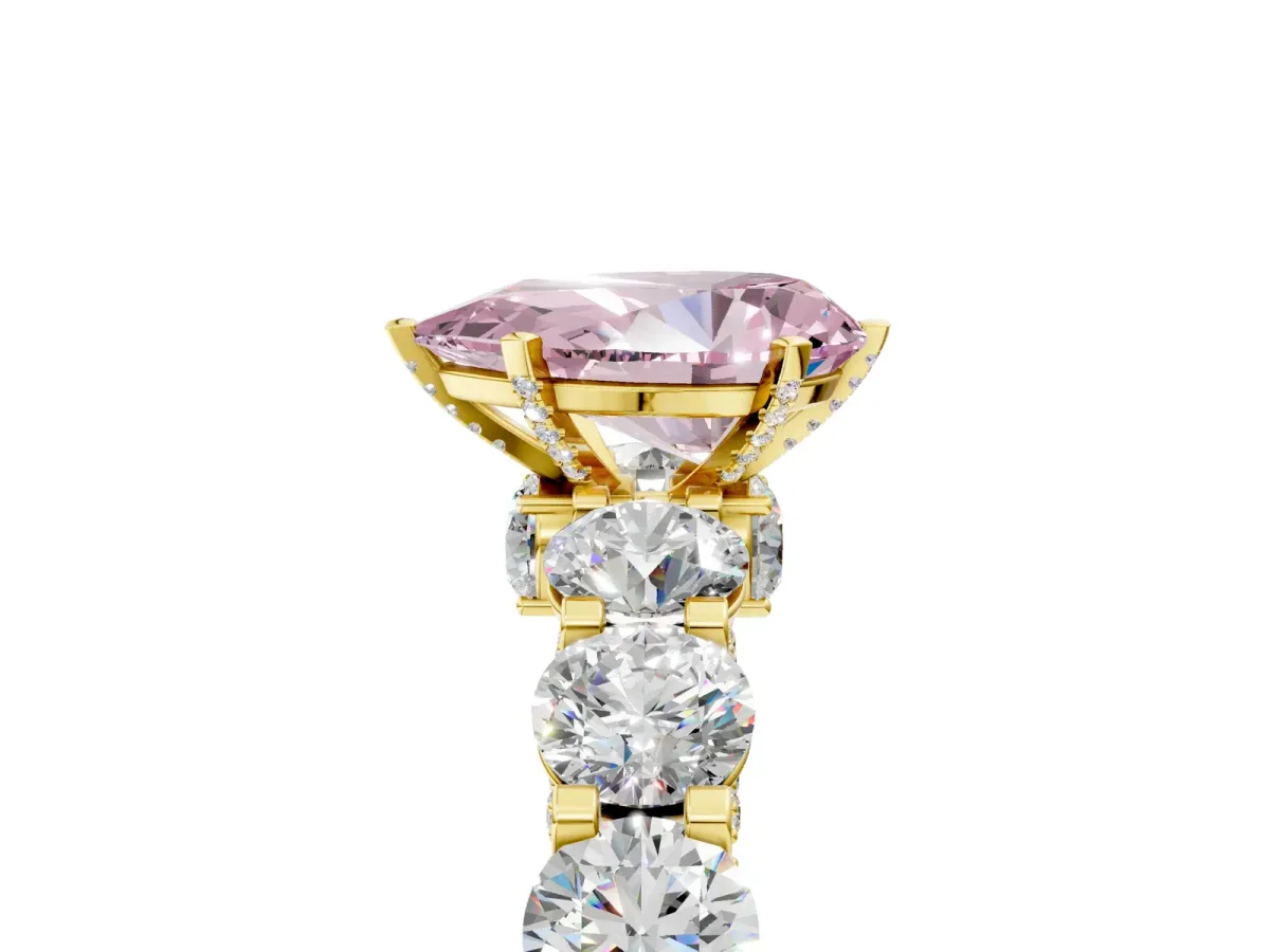 Fancy Pink Pear Cut Diamond Side Stone Engagement Ring with Four-Prong Setting Yellow gold