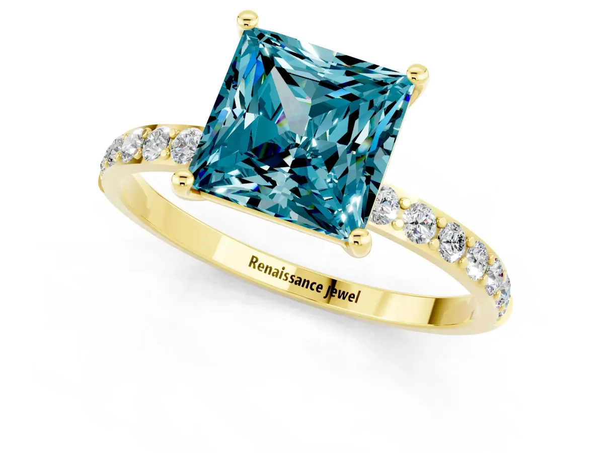 Princess Cut Blue Topaz Solitaire Ring with Round Pavé Band and Prong Setting Yellow gold
