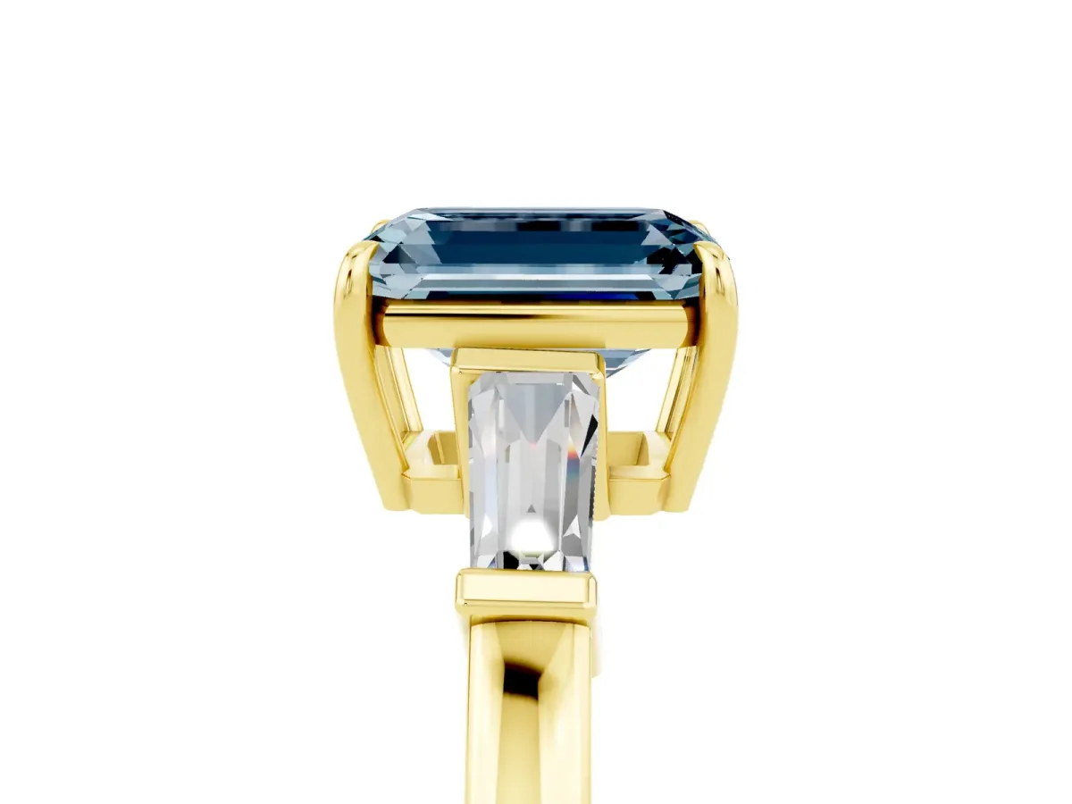 Emerald Cut Aquamarine Three-Stone Ring with Tapered Baguette Side Stones and Prong Setting Yellow gold