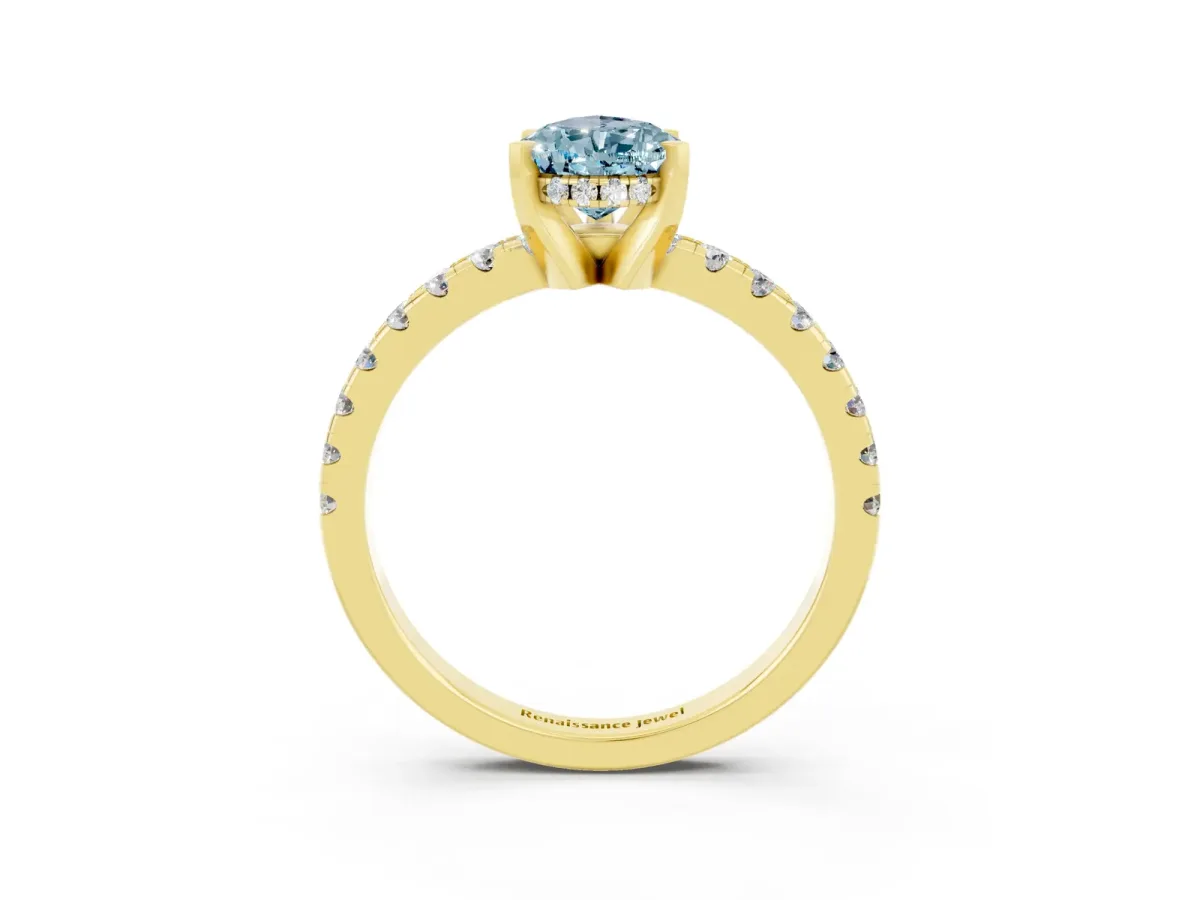 Pear Cut Aquamarine Solitaire Ring with Round Pavé Band and Four-Prong Setting Yellow gold