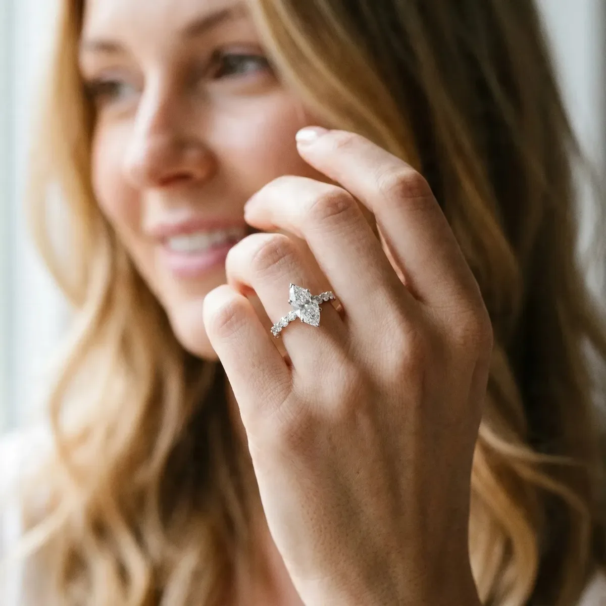 Marquise Cut Solitaire Diamond Ring with Pave Band and Four-Prong Setting Platinum