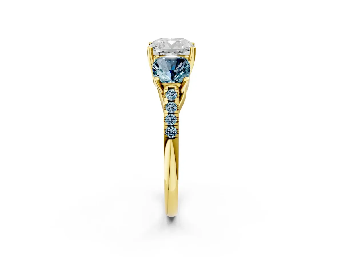 Three-Stone Cushion Cut Diamond Ring with Round Aquamarine Pavé Band and Prong Setting Yellow gold
