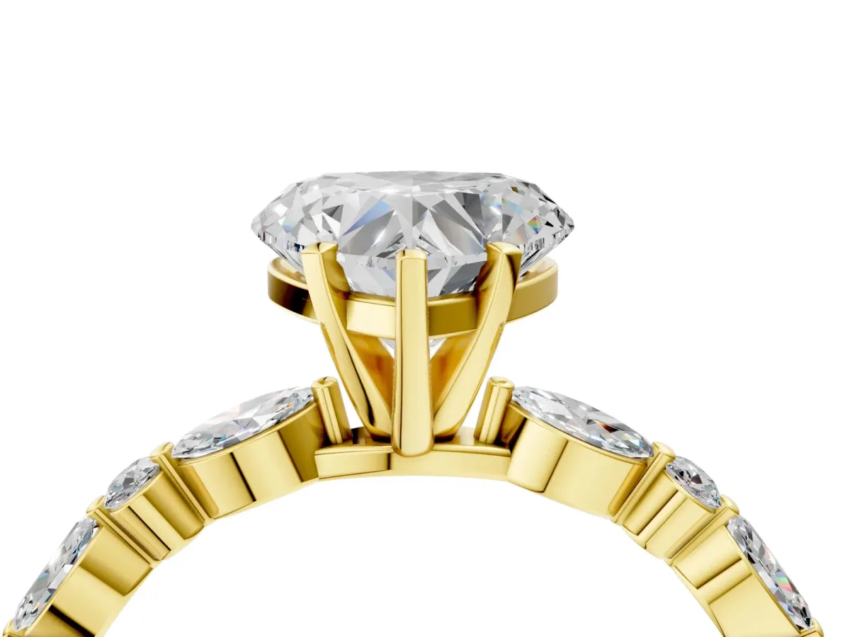 Heart Cut Diamond Ring with Marquise and Round Side Stones and Four-Prong Setting Yellow gold