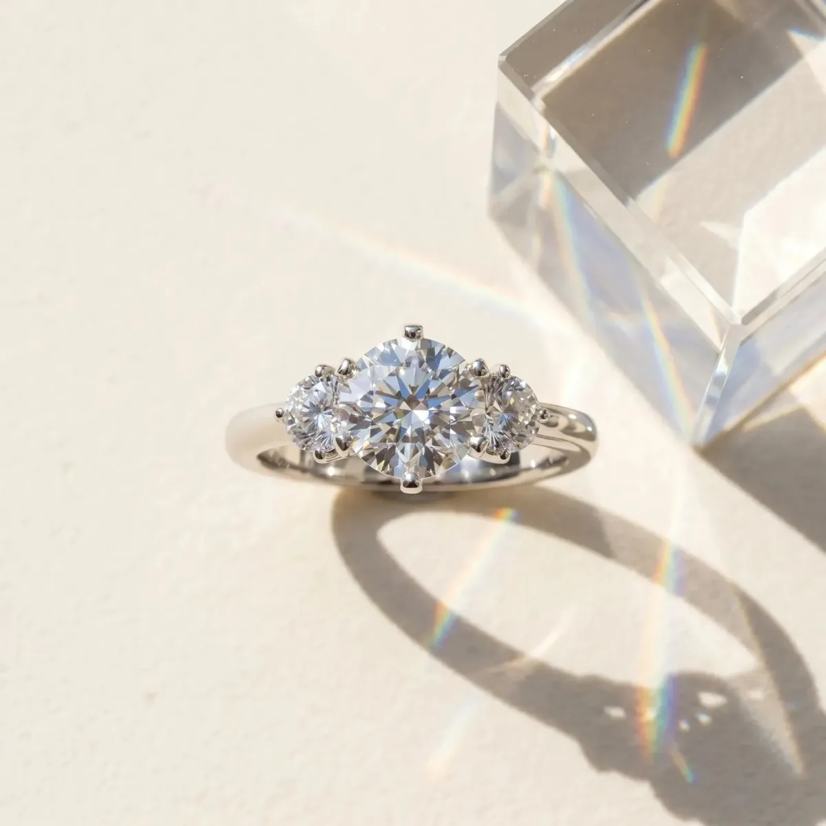 Three-Stone Round Cut Cut Solitaire Diamond Ring with Prong Setting Platinum
