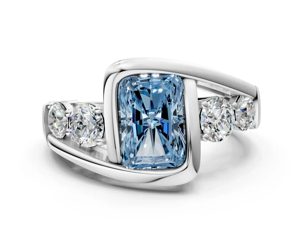 Fancy Blue Bezel Set Radiant Cut Diamond Bypass Ring with Round Accents Platinum
