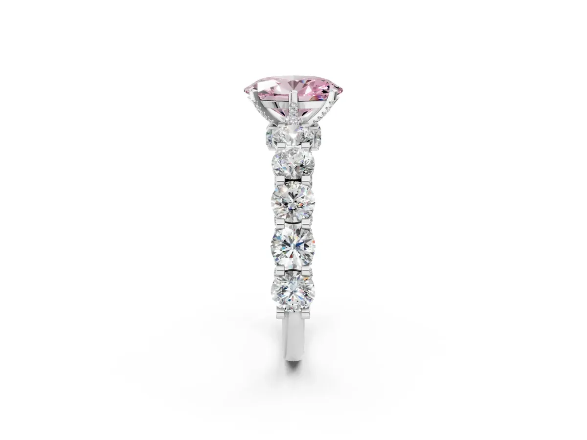 Fancy Pink Oval Cut Diamond Side Stone Engagement Ring with Four-Prong Setting Platinum
