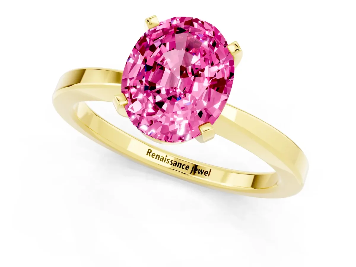 Oval Cut Pink Sapphire Solitaire Engagement Ring with Classic Band and Four-Prong Setting Yellow gold
