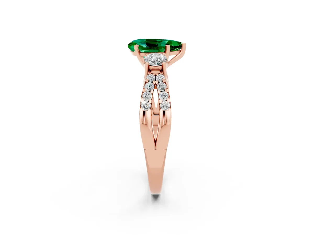 Pear Cut Emerald Three-Stone Ring with Pavé Split Shank and Four-Prong Setting Rose gold