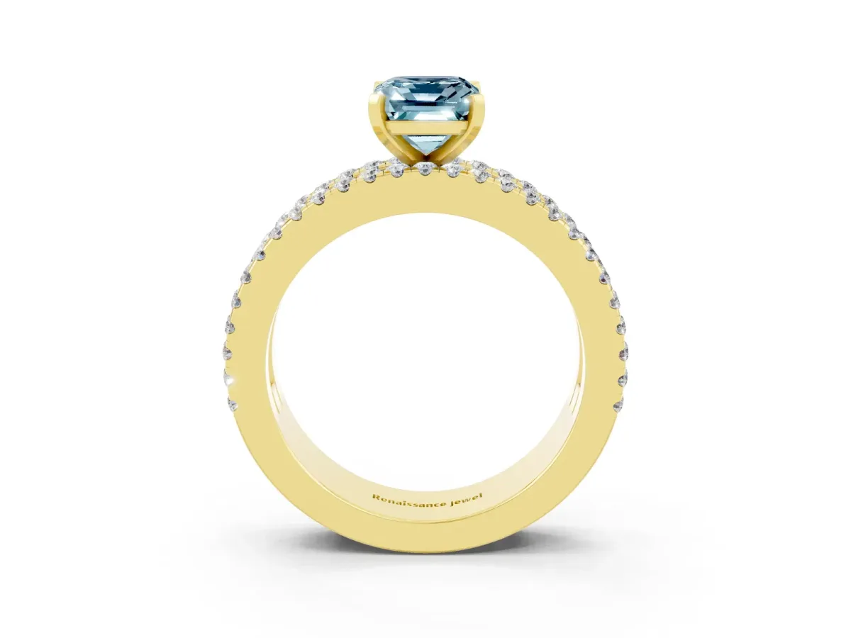Emerald Cut Aquamarine Solitaire Ring with Pavé and Channel Set Band Yellow gold
