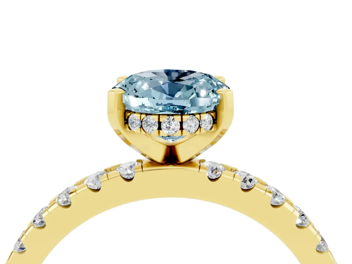 Oval Cut Aquamarine Solitaire Ring with Round Pavé Band and Four-Prong Setting Yellow gold
