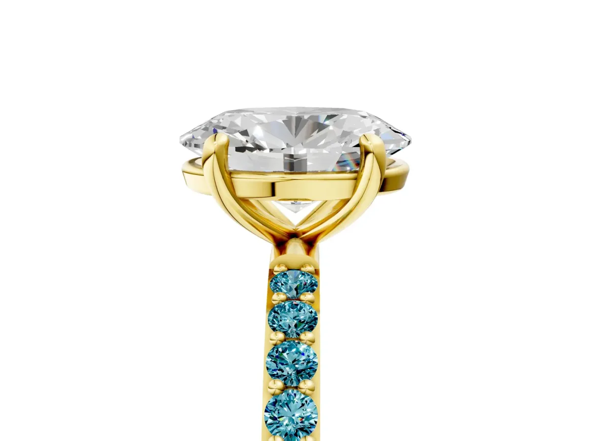 Oval Cut Diamond Solitaire Ring with Round Blue Topaz Pavé Band and Prong Setting Yellow gold