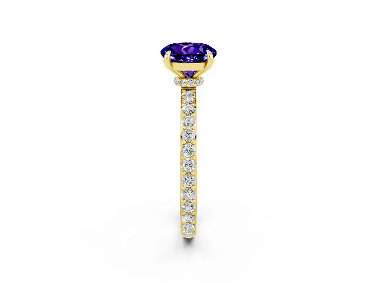 Round Cut Tanzanite Solitaire Engagement Ring with Pavé Band and Four-Prong Setting Yellow gold