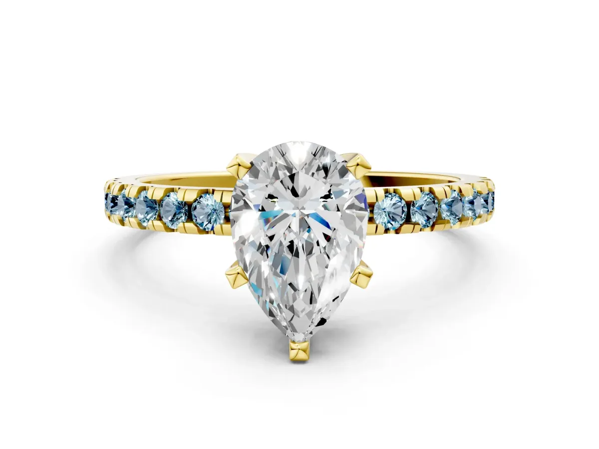Pear Cut Diamond Solitaire Ring with Round Aquamarine Pavé Band and Four-Prong Setting Yellow gold