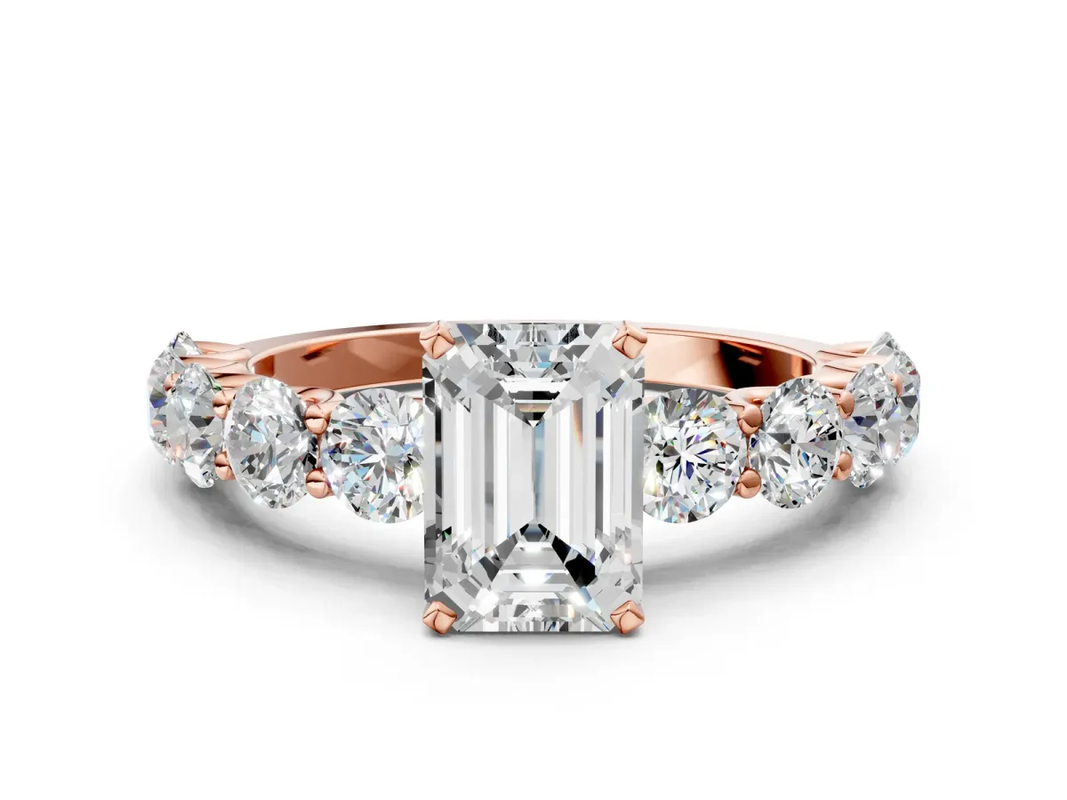 Emerald Cut Diamond Prong Setting with Side Stones on a Pave Band Rose gold