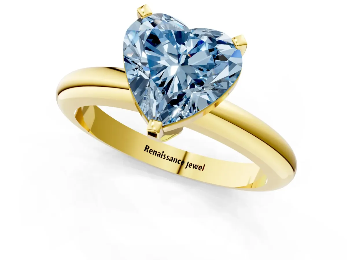 Fancy Blue Heart Cut Diamond Solitaire Engagement Ring with Round Band and Four-Prong Setting Yellow gold