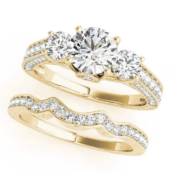 Three-Stone Round Cut Cut Diamond Engagement Ring with Split Shank and Prong Setting Yellow gold