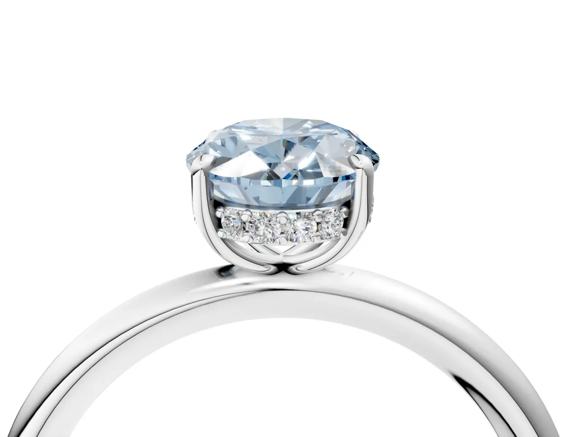 Fancy Blue Oval Cut Diamond Solitaire Ring with Thin Band and Four-Prong Setting White gold