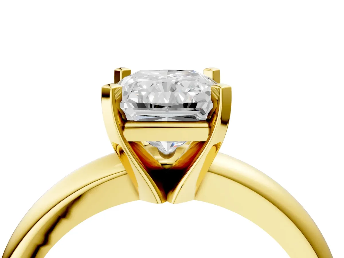 Radiant Cut Diamond Solitaire Engagement Ring with Round Band and Four-Prong Setting Yellow gold