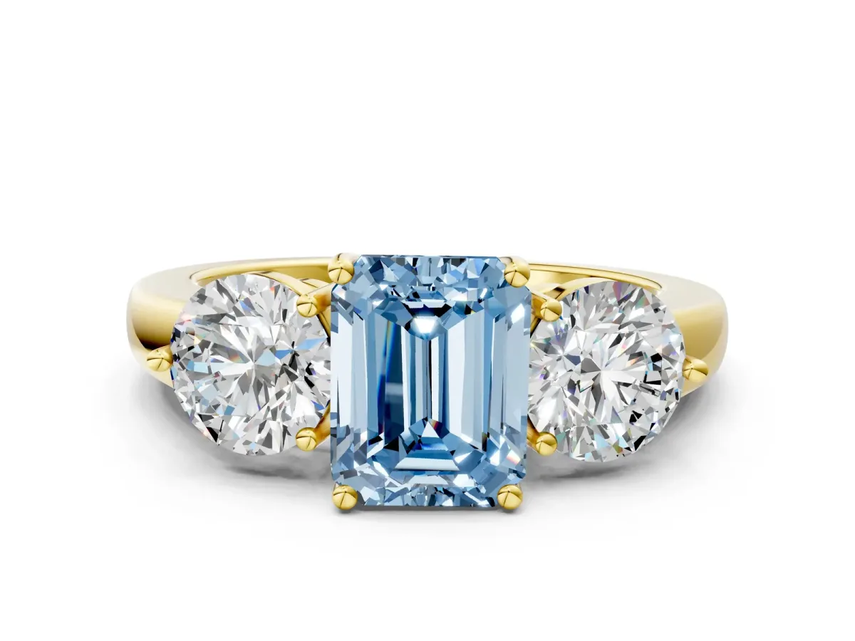 Fancy Blue Emerald Cut Diamond Three-Stone Ring with Prong Setting and Classic Band Yellow gold