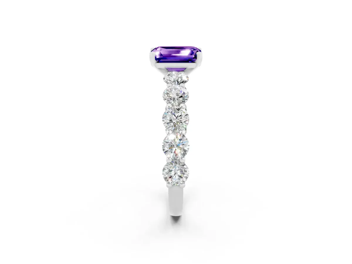 Emerald Cut Tanzanite Prong Setting with Side Stones on a Pave Band Silver